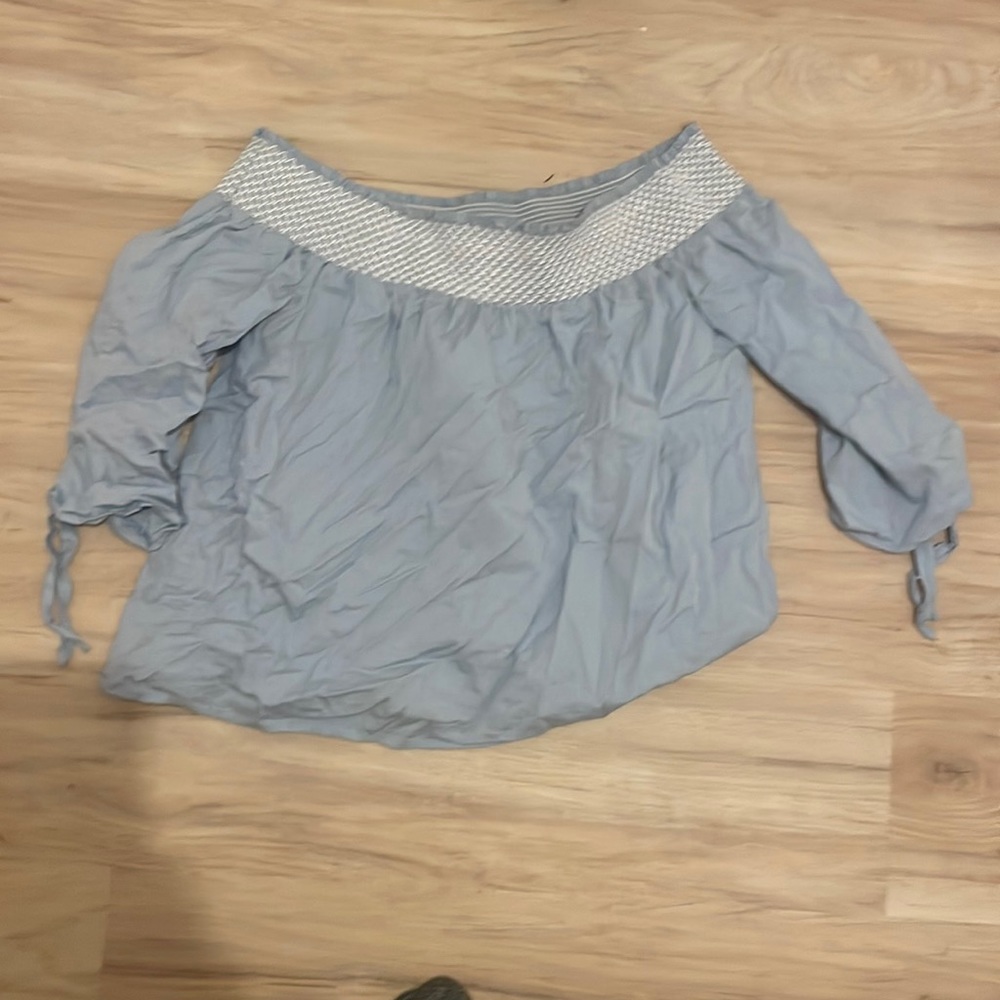 Off the shoulder light blue shirt